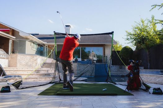 SIGPRO Golf Net Outdoors with golfer hitting into net