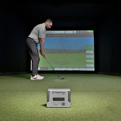 flightscope mevo plus grey with golfer indoors